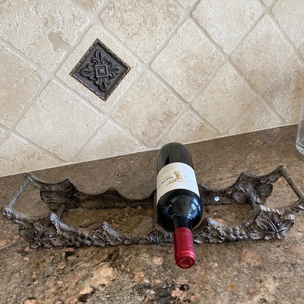 Wine bottle holder by Arthur court